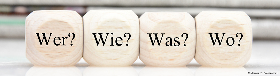 Vier Würfel mit Fragewörtern